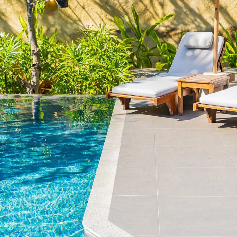 umbrella-chair-around-outdoor-swimming-pool-concrete-slabs-768×768 pool-deck-leveling